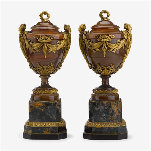 Lot 321 - An exceptional pair of Louis XVI style gilt bronze mounted agate and bloodstone covered urns