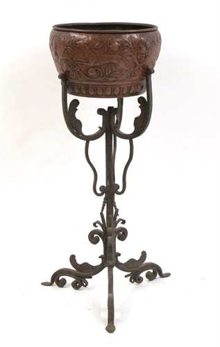 Lot 176A - English Arts & Crafts hammered and repoussé copper jardiniere and wrought iron stand