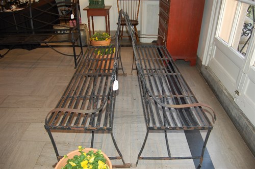 Lot 71 - Three black painted Regency-style strapwork iron benches