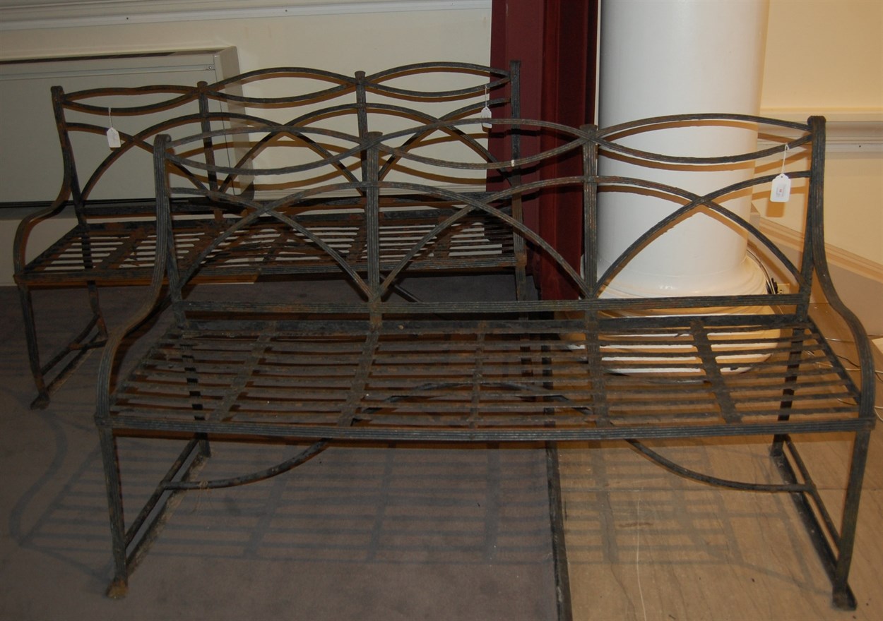 Lot 68 - Pair of black painted Regency-style strapwork iron benches