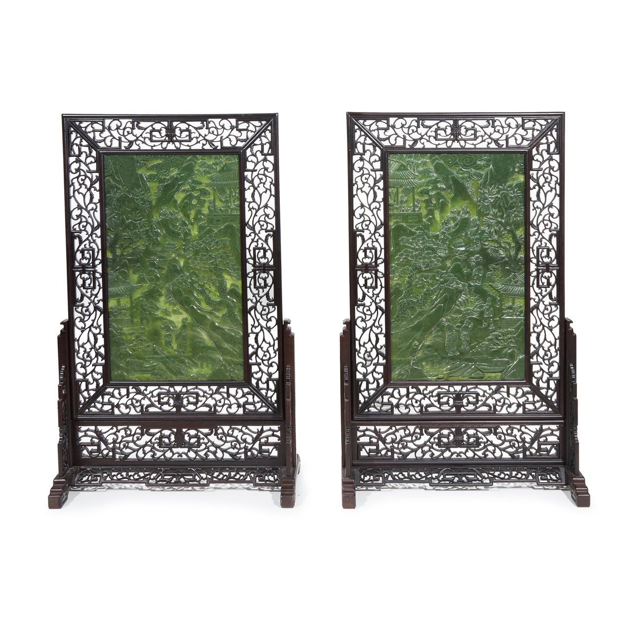 Lot 155 - A pair of large Chinese spinach green jade and carved hardwood 'landscape' floor screens