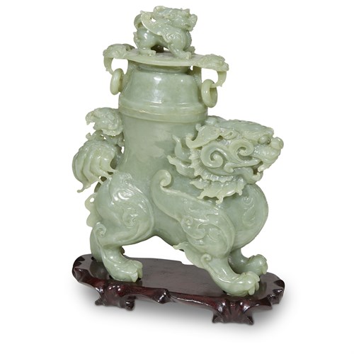 Lot 140 - A Chinese carved green hardstone Buddhist 'lion' vase and cover