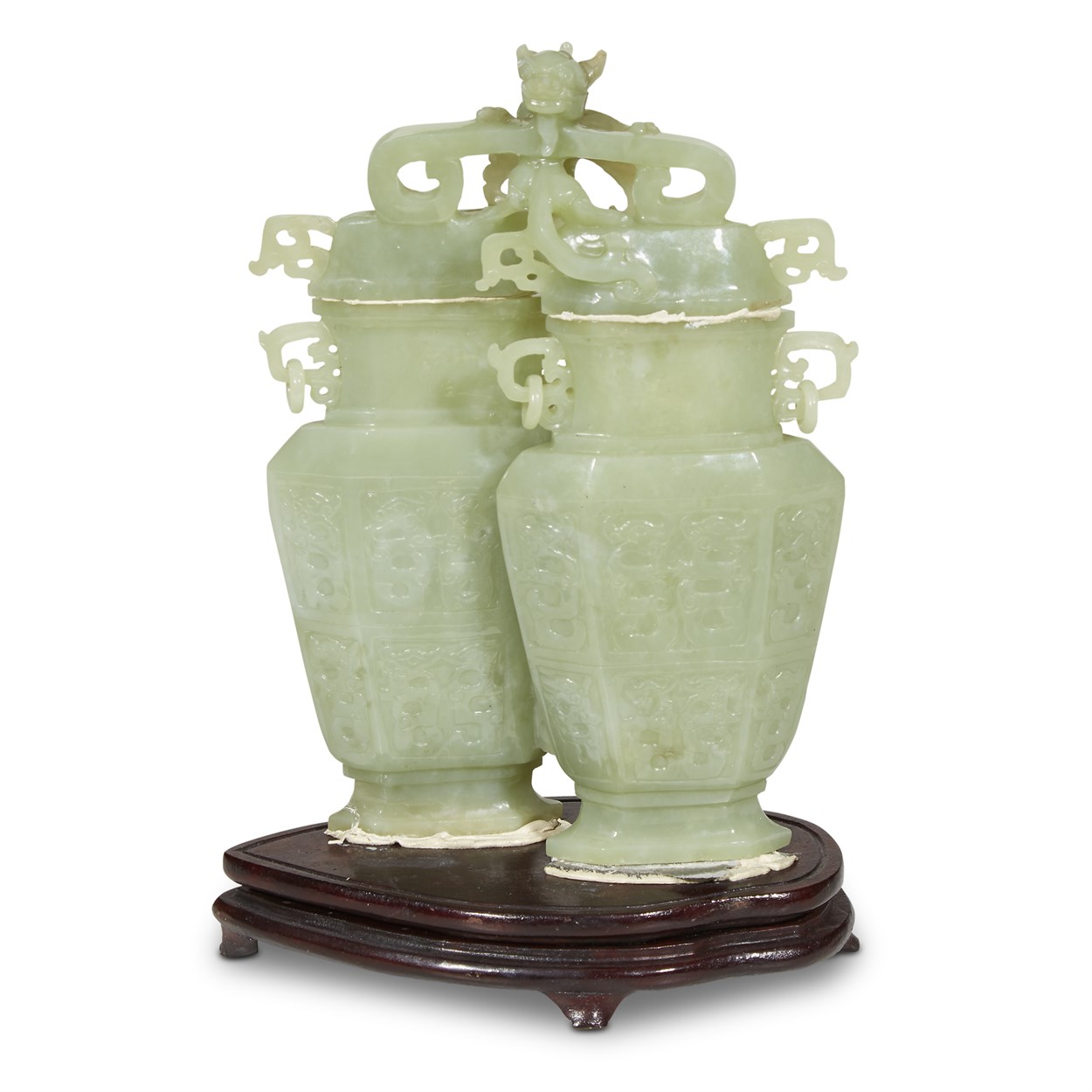Lot 141 - A Chinese pale green jade 'qilong' double vase and cover