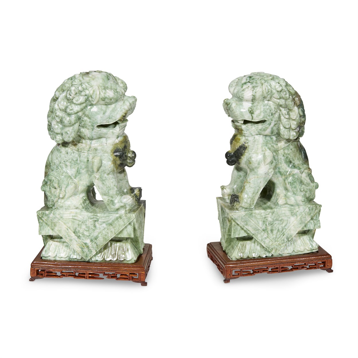 Lot 143 - A pair of Chinese jadeite Buddhist lions