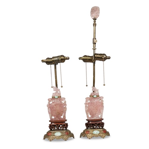 Lot 121 - A pair of Chinese rose quartz covered urns