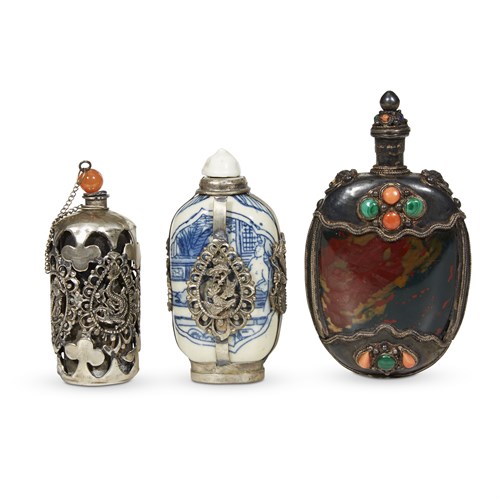Lot 169 - A group of three Chinese silver-embellished snuff bottles