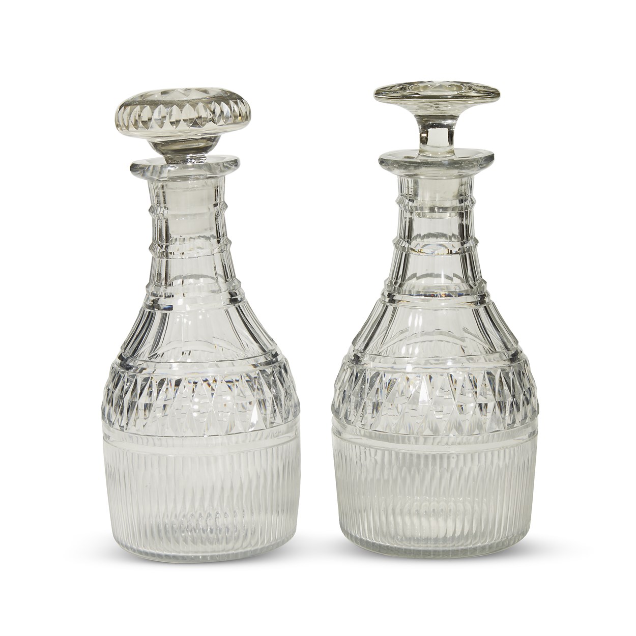 Lot 100 - A pair of Anglo-Irish Regency cut glass stoppered decanters