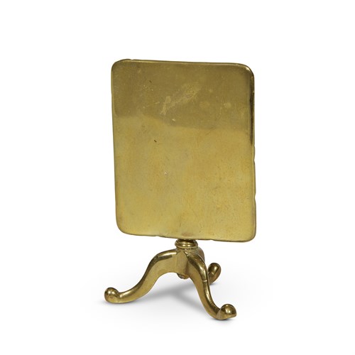 Lot 94 - A brass candle reflector in the form of a miniature tilt-top table