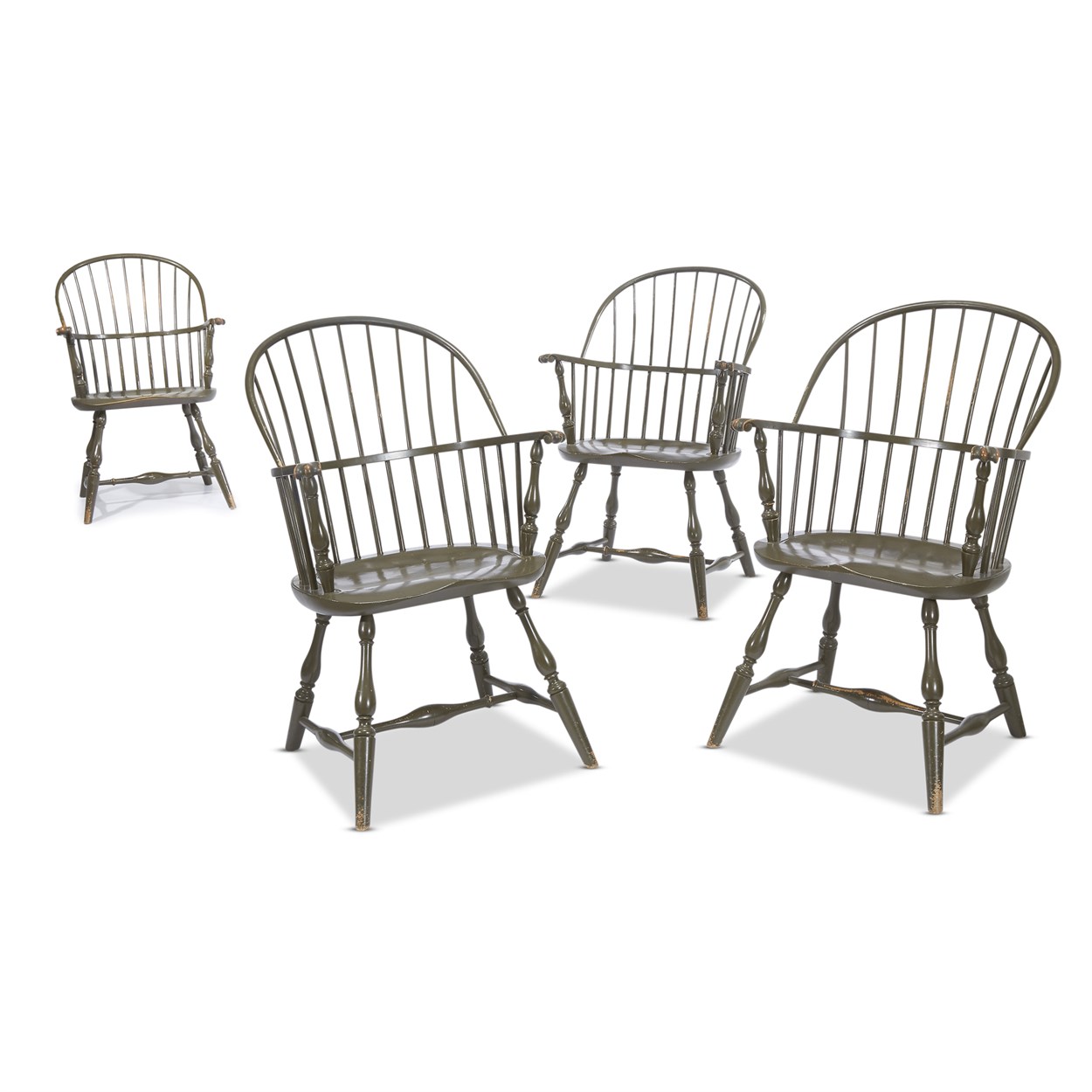 Lot 83 - A set of four green-painted hoopback Windsor armchairs