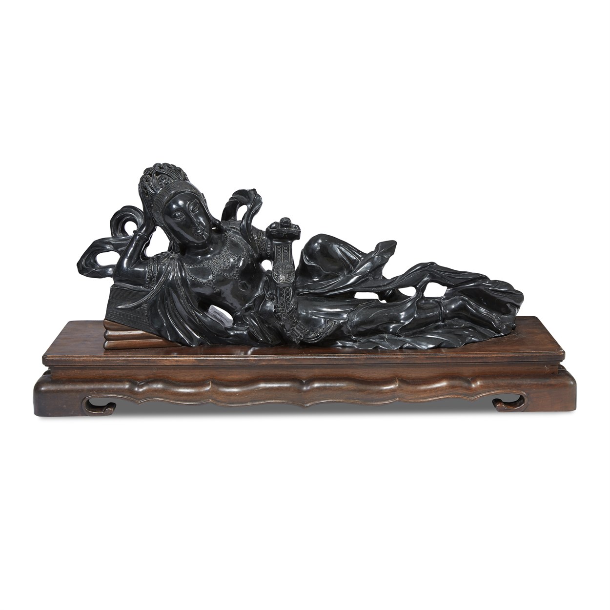 Lot 153 - A large Chinese dark green black jade reclined Guanyin