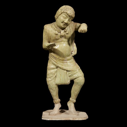 Lot 237 - A Chinese straw-glazed figure of a foreign dancer