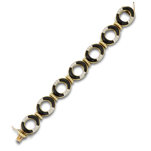 Lot 58 - A diamond, black onyx and eighteen karat gold bracelet, La Triomphe