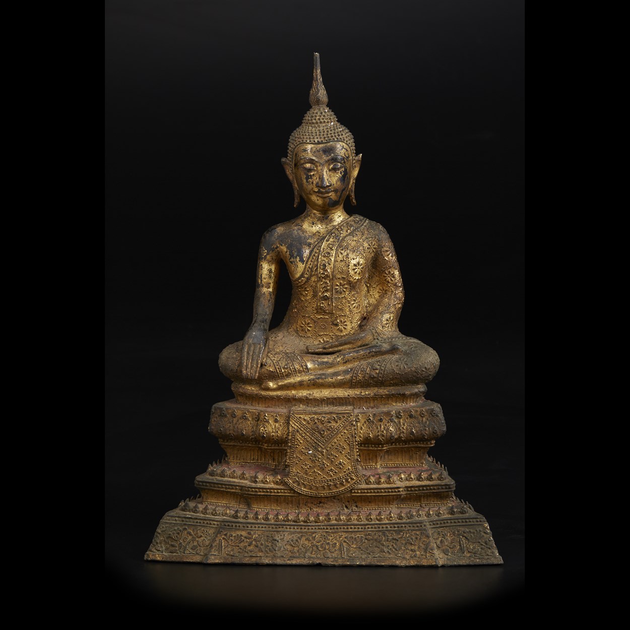Lot 116 - A Thai gilt-lacquered bronze figure of a seated Buddha