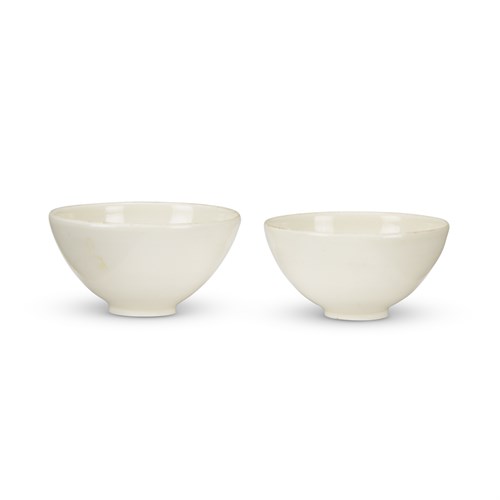 Lot 243 - Two similar Chinese Ding-type ceramic small hemispherical bowls