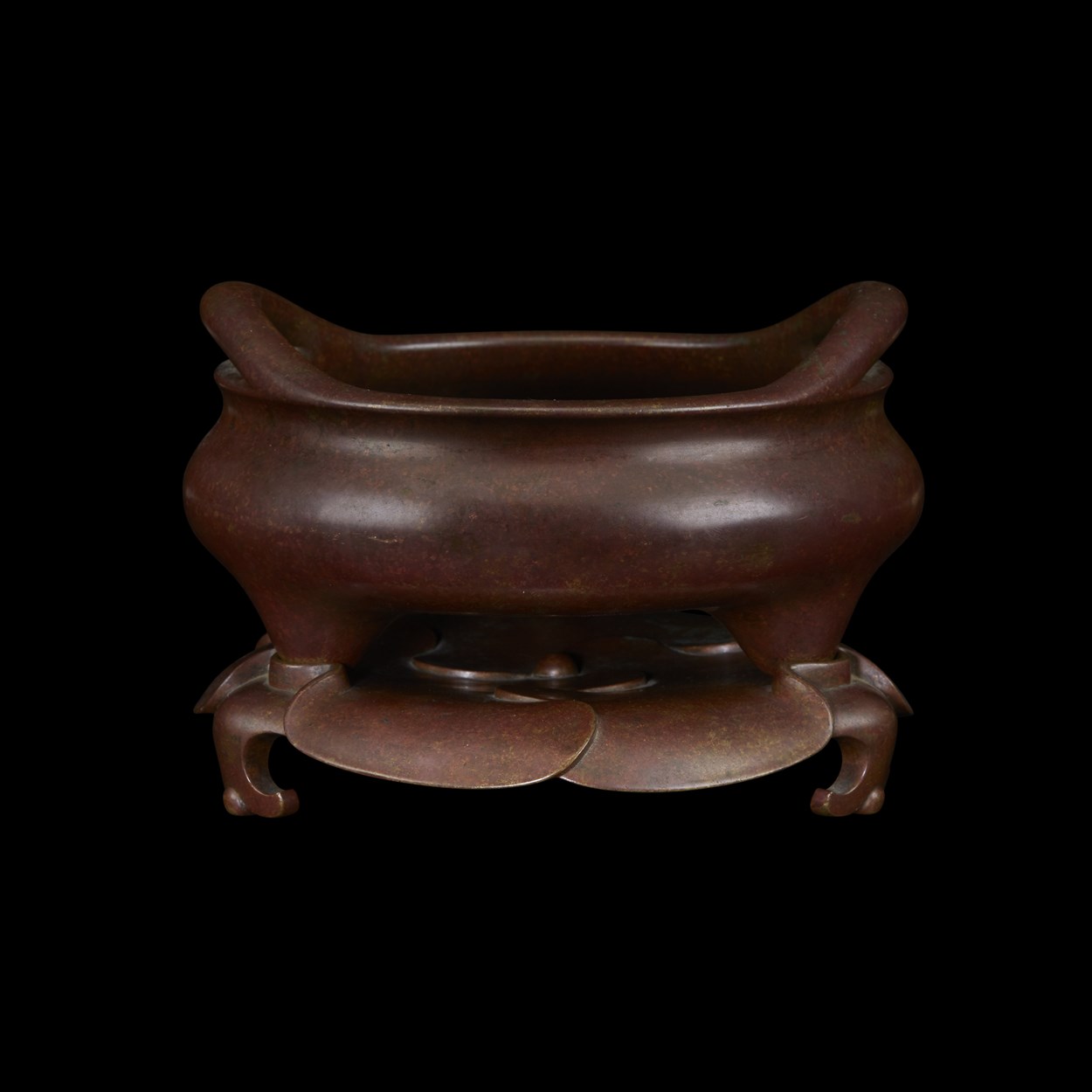 Lot 531 - A Chinese patinated bronze tripod censer and foliate stand