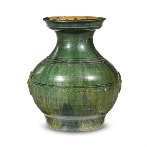 Lot 210 - A Chinese green and amber-glazed pottery jar, Hu