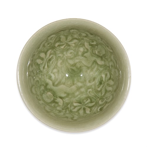 Lot 227 - A Chinese Yaozhou-type "Boys and Lotus" molded small conical bowl
