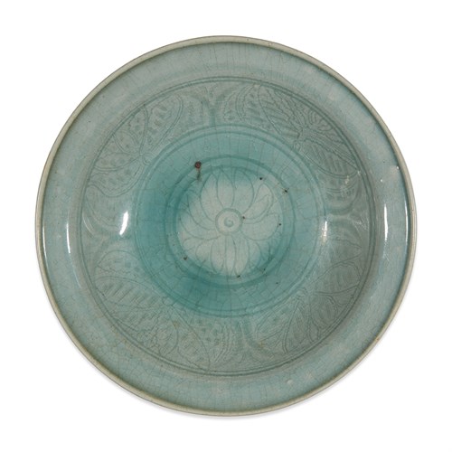 Lot 203 - A Thai celadon-glazed dish with incised lotus