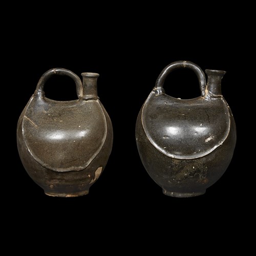 Lot 216 - A pair of Chinese black-glazed flask-form ewers