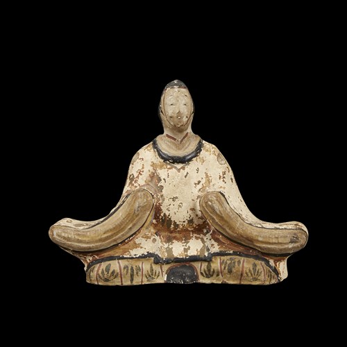 Lot 82 - A Japanese painted earthenware seated figure