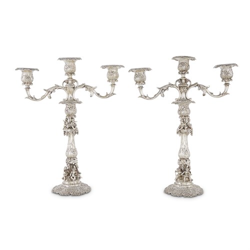 Lot 94 - A pair of German silver Renaissance Revival three-light candelabra