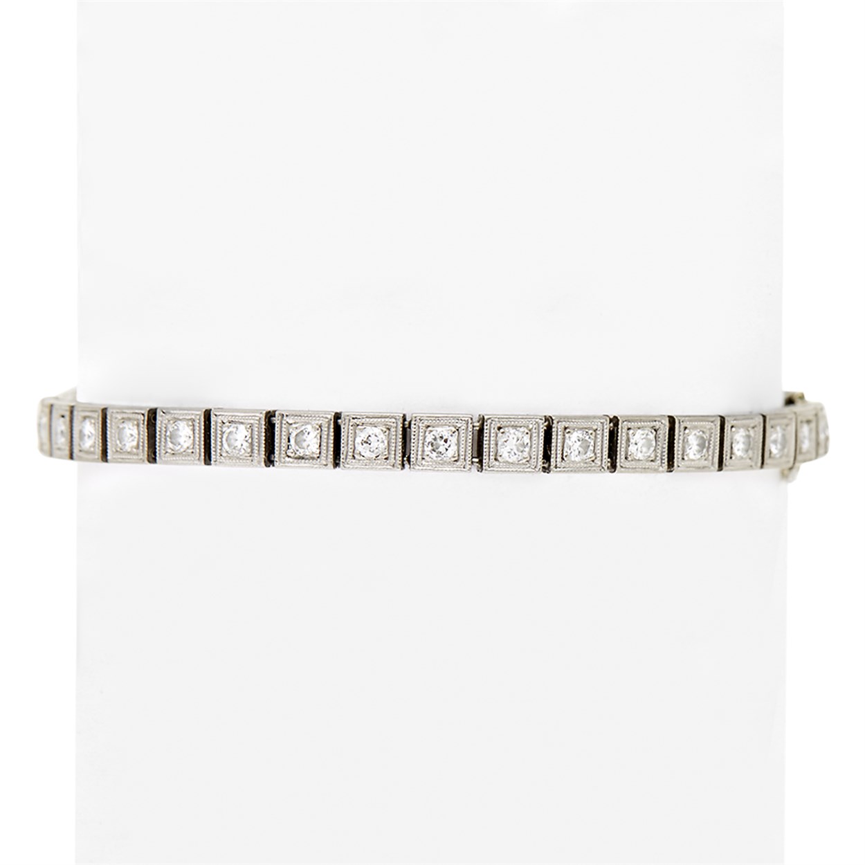 Lot 21 - A diamond, simulant and platinum line bracelet