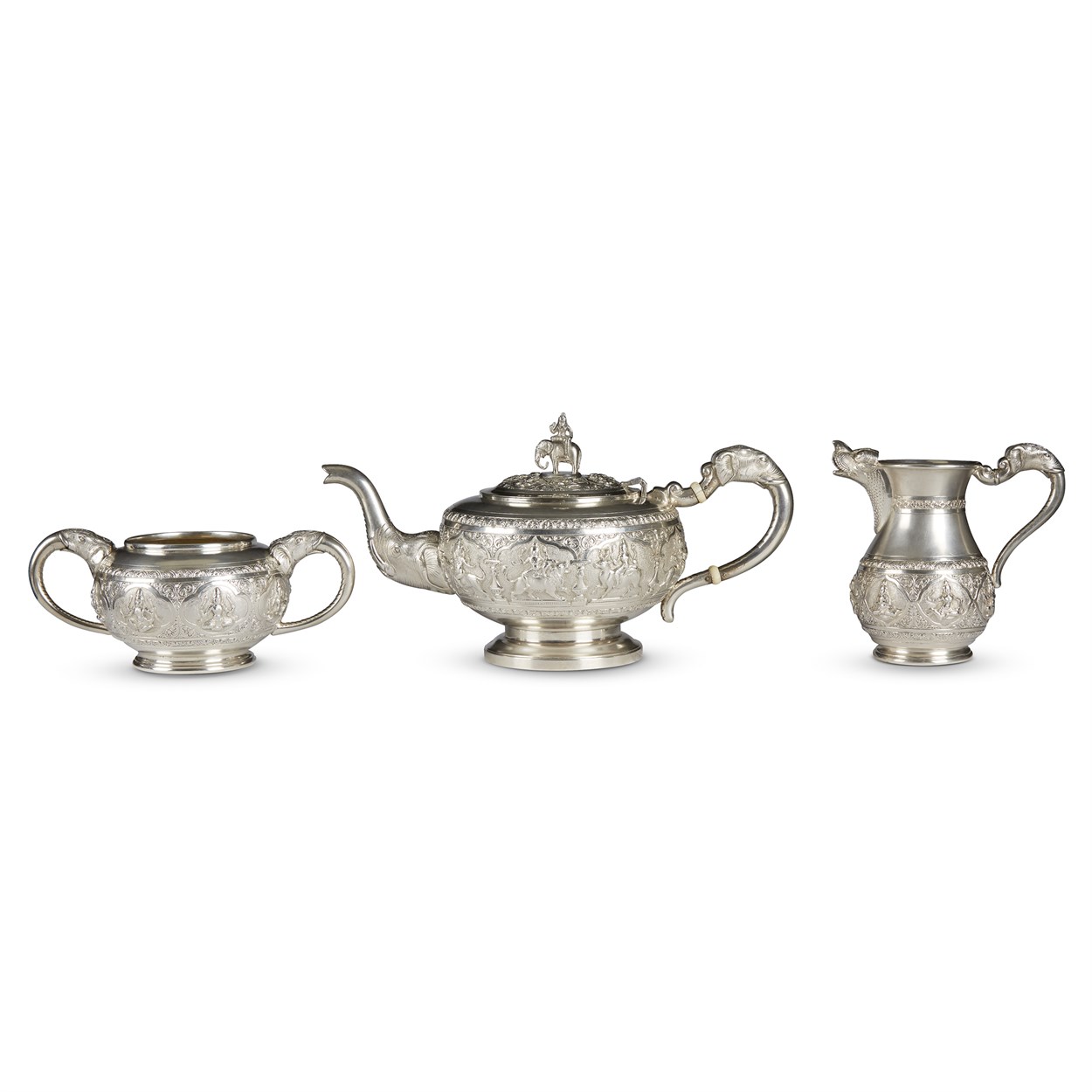 Lot 144 - An Indian silver three-piece tea service