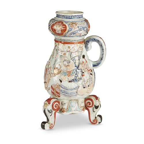 Lot 86 - A Japanese molded porcelain coffee urn, Arita, decorated in an Imari palette