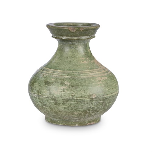 Lot 232 - A Chinese small green-glazed earthenware jar, Hu