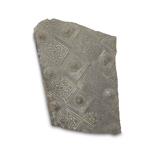 Lot 233 - A Chinese stamped grey pottery tile fragment