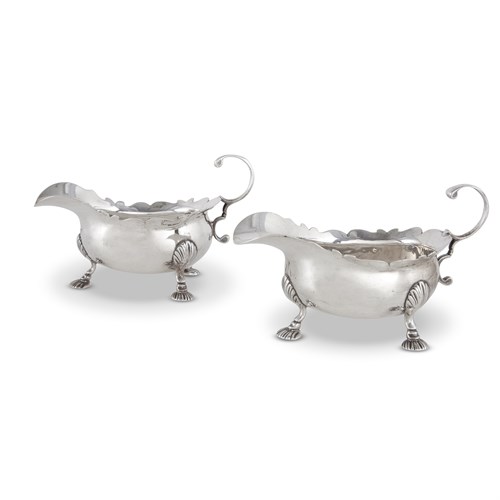 Lot 45 - A pair of George II sterling silver sauce boats