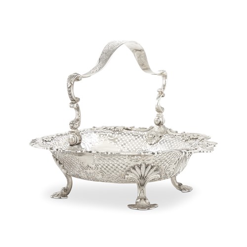 Lot 43 - A George II sterling silver swing handled reticulated basket