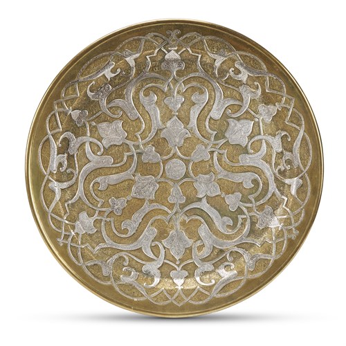 Lot 145 - A Mamluk revival silver-inlaid brass circular charger