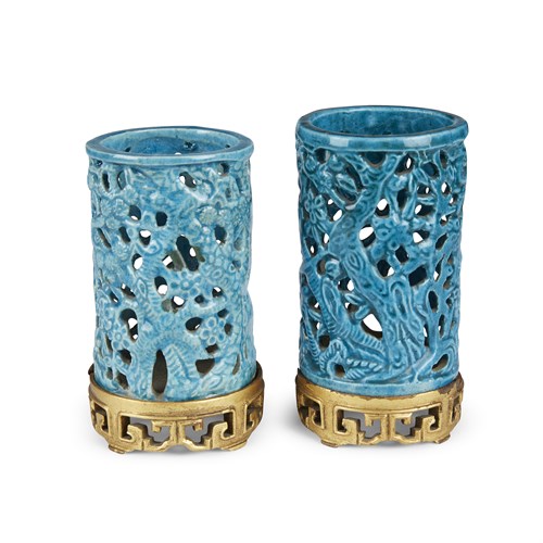 Lot 254 - A matched pair of turquoise-glazed pierced cylindrical small brush pots, with later gilt wood stands