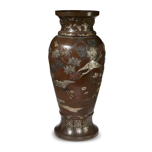 Lot 62 - An impressive Japanese patinated bronze and mixed-metal vase, decorated with cranes among flowering trees