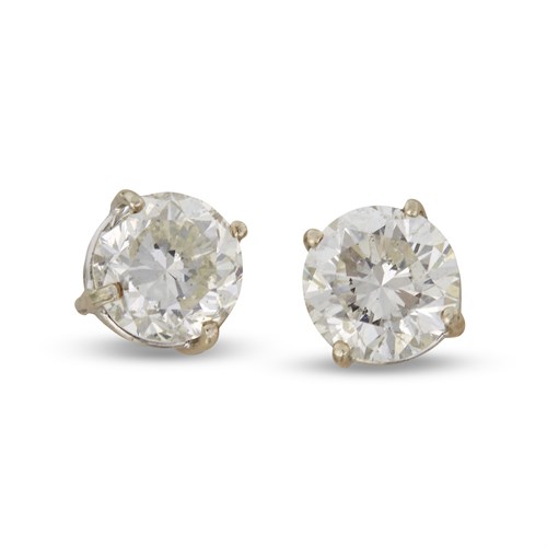 Lot 130 - A pair of diamond and fourteen karat white gold studs
