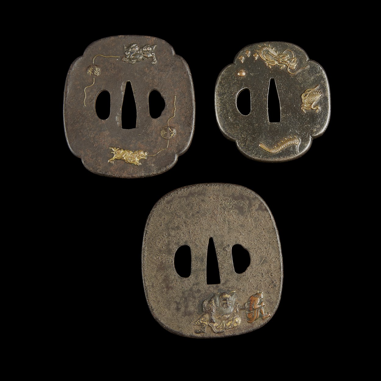 Lot 51 - Group of three Japanese mixed metal-inlaid iron tsuba