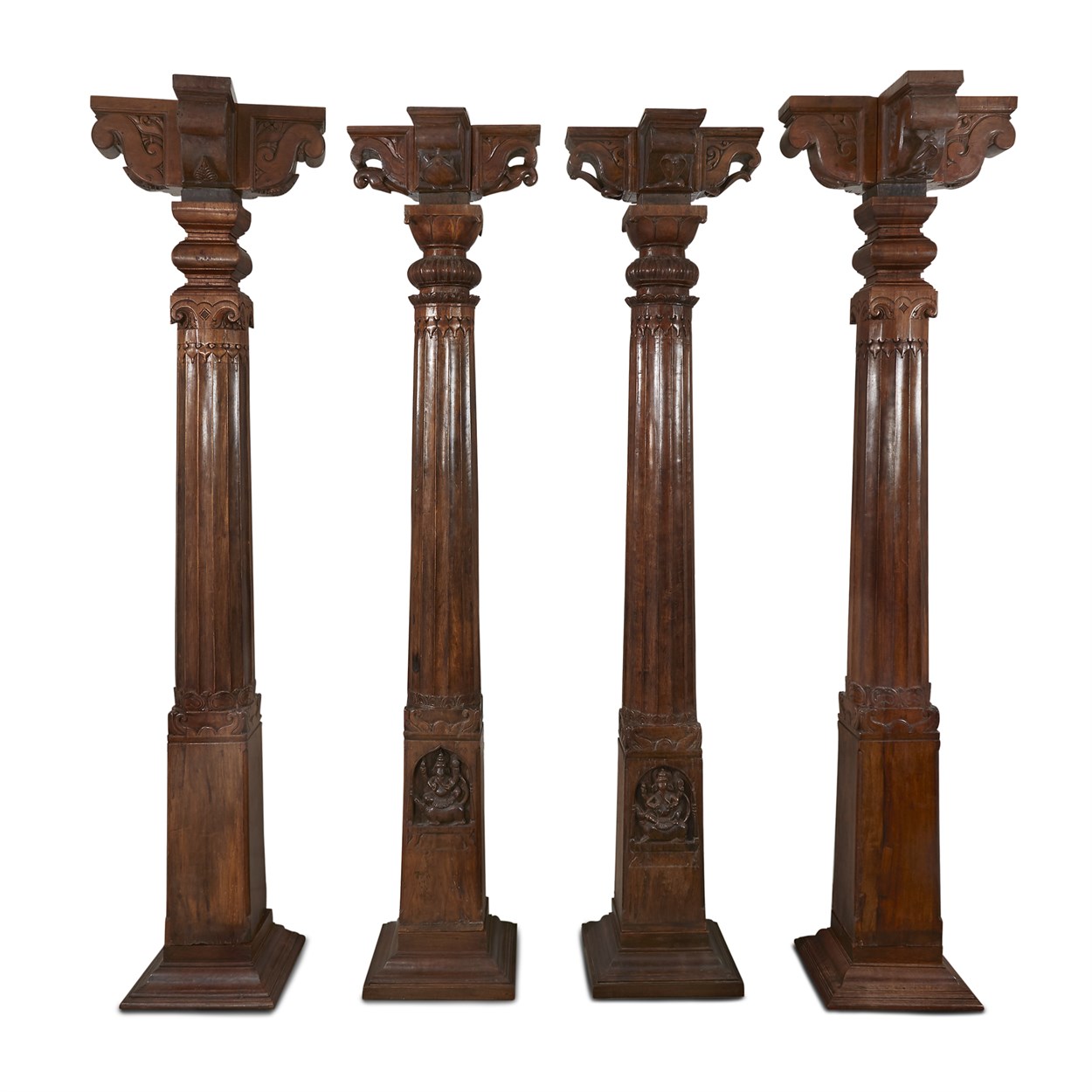 Lot 126 - A set of four associated Indian carved teak columns, capitals and bases