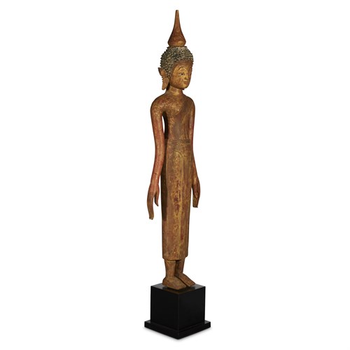 Lot 115 - A Laotian carved and gilt wood figure of a standing Buddha