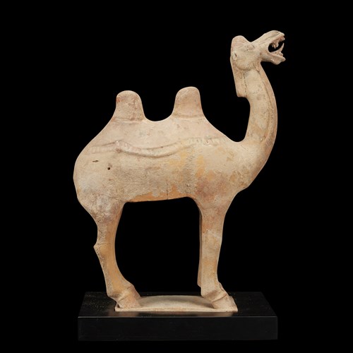 Lot 150 - A Chinese painted pottery figure of a camel and a rider