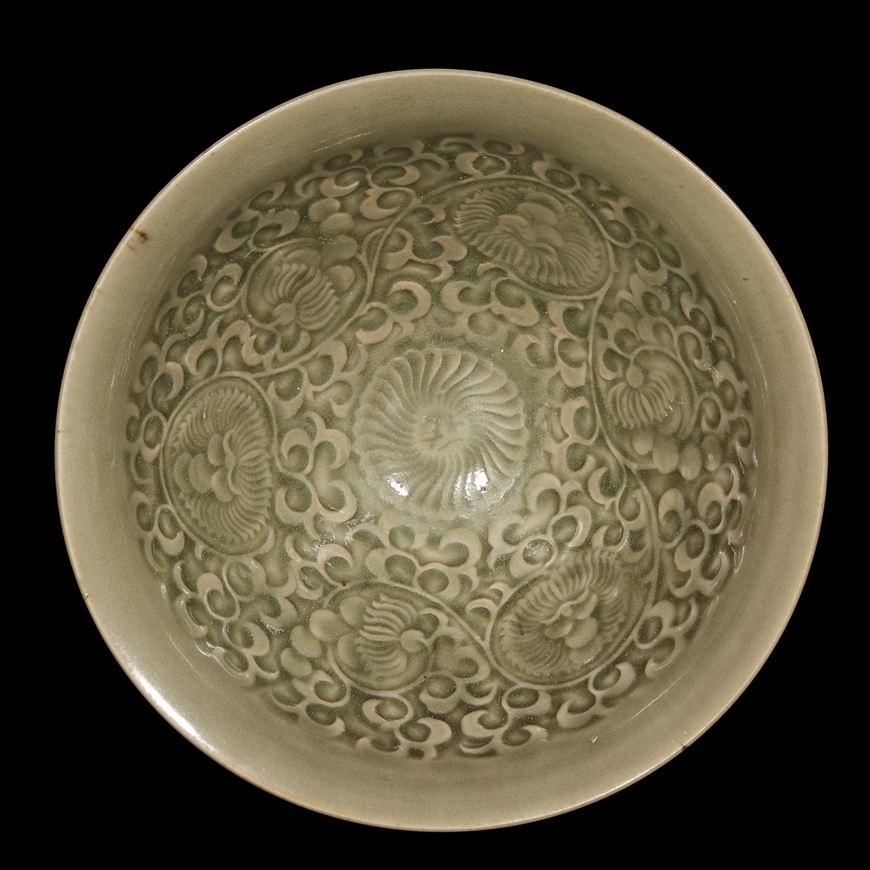 Lot 165 - A Chinese Yaozhou celadon-glazed molded conical bowl