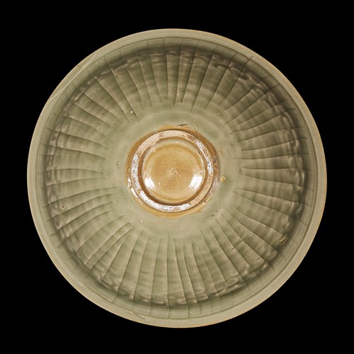 Lot 165 - A Chinese Yaozhou celadon-glazed molded conical bowl