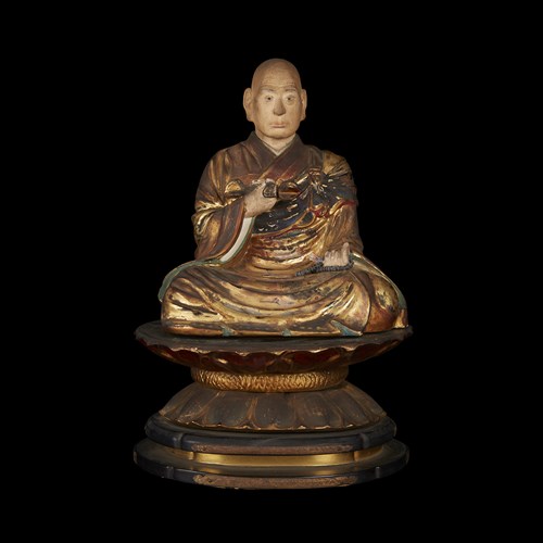 Lot 39 - A Japanese carved, painted, lacquered and gilt wood figure of a seated Buddhist monk