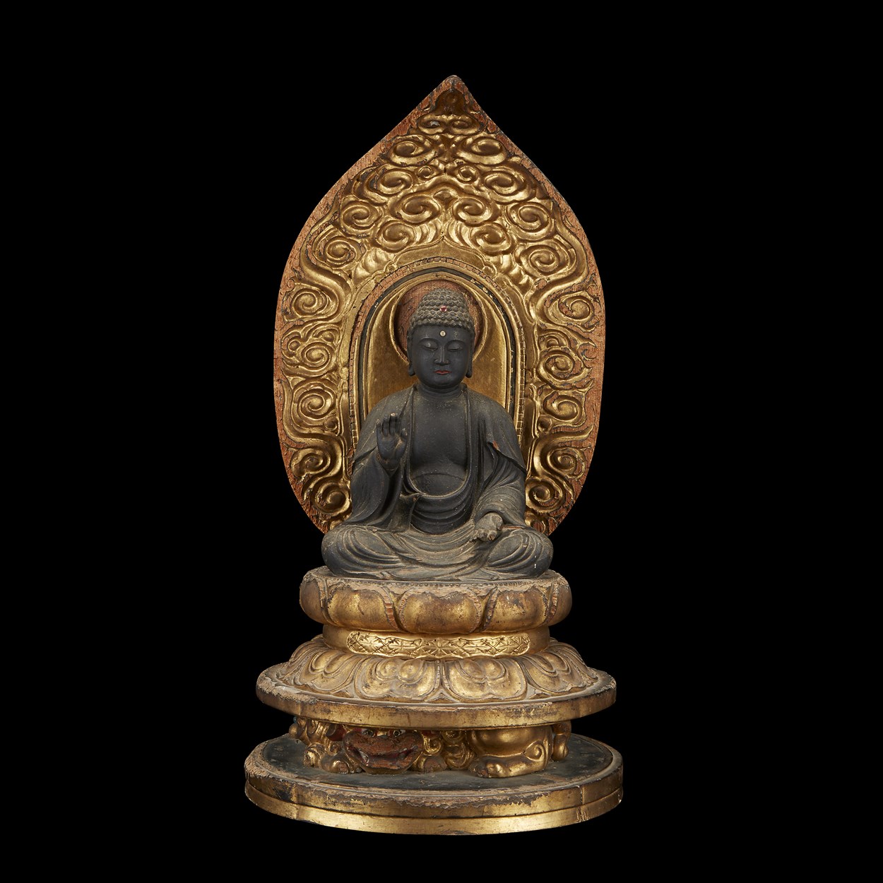 Lot 38 - A Japanese carved wood and gilt lacquered figure of Amida Buddha seated