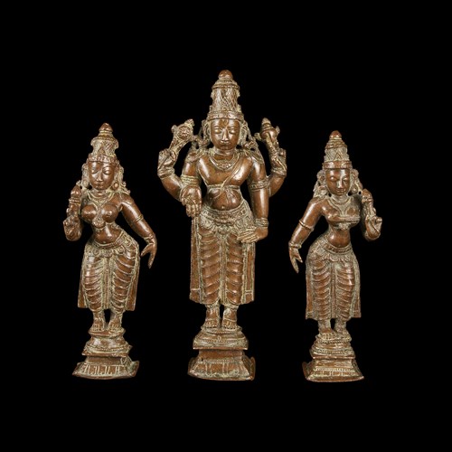 Lot 130 - An Indian copper alloy figure of Vishnu and two similar figures of Lakshmi