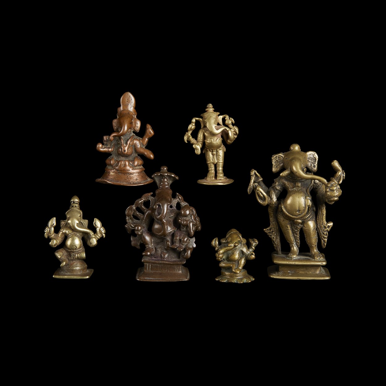 Lot 134 - A group of six Indian copper alloy figures of Ganesha