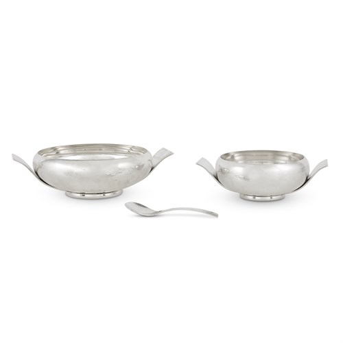 Lot 89 - An American sterling silver hammered serving set