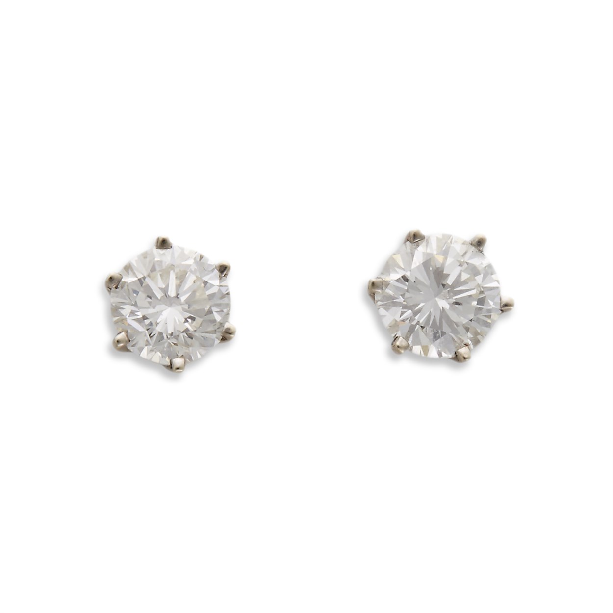 Lot 69 - A pair of diamond and fourteen karat white gold studs