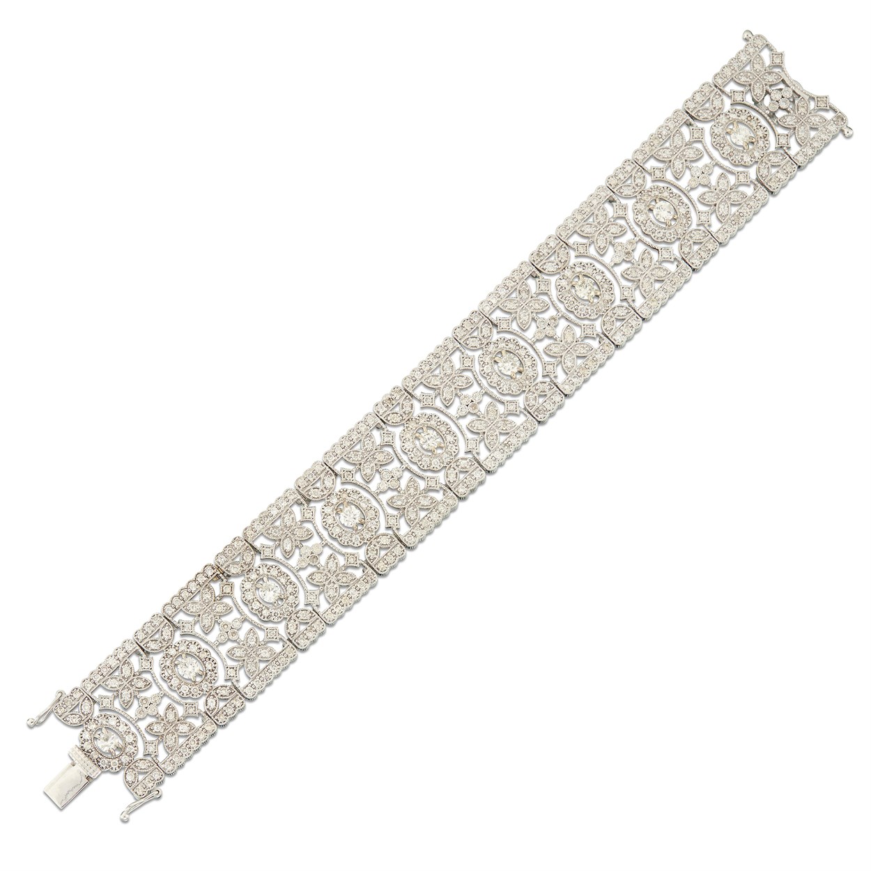 Lot 79 - A diamond and eighteen karat gold strap bracelet