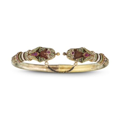 Lot 5 - An antique Egyptian revival enamel gold and agate bangle bracelet